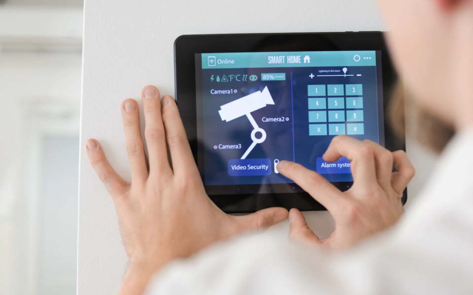 a person accessing the security cameras through a tablet